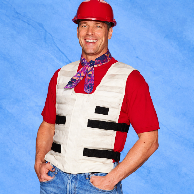 Construction worker wearing a cooling vest, cooling bandana, and hard hat as cooling technology for workplace safety